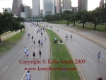 Racers running towards and away from the downtown Houston skyline